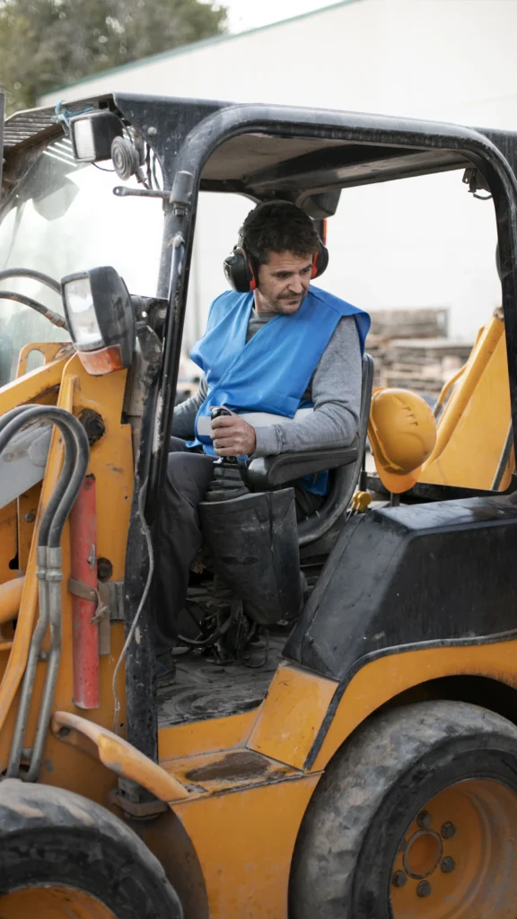 Pakistani heavy equipment operator operating construction machinery