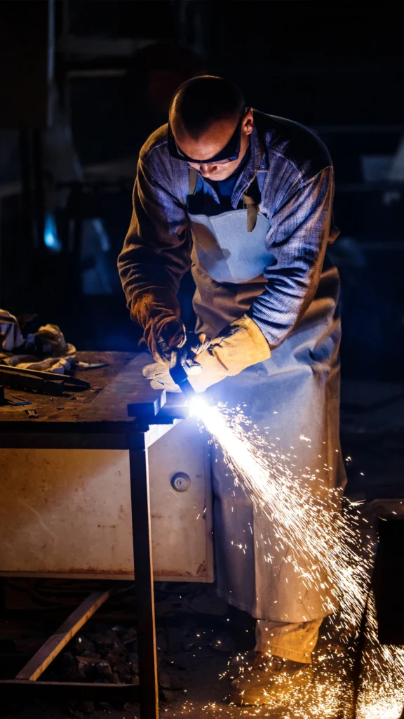Certified Pakistani welder working on a steel fabrication project