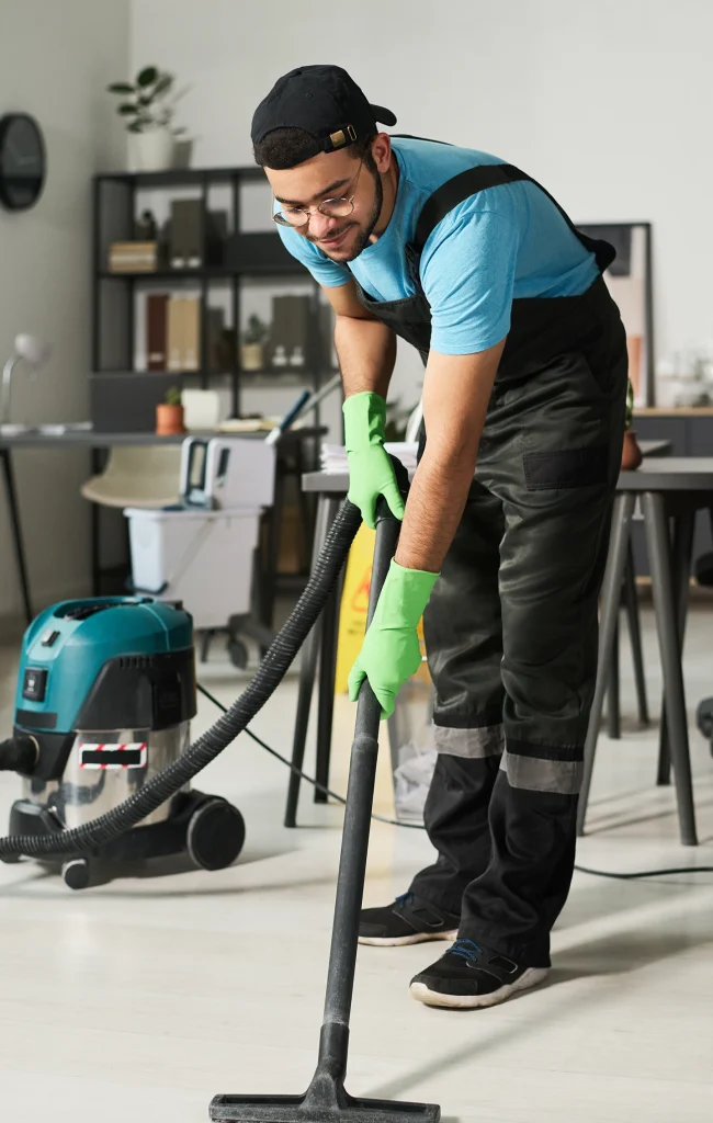 Housekeeping staff cleaning office floor